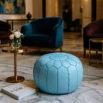 Sky blue leather floor ottoman 21 inch round pouf in elegant living room, handcrafted footrest seating