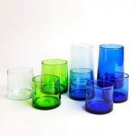 Assorted collection of eight moroccan wine glasses—clear, green, aqua, and cobalt—grouped together for a product shot.