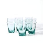 Six authentic beldi tea glasses handblown in aqua gradient showcasing traditional Moroccan craftsmanship