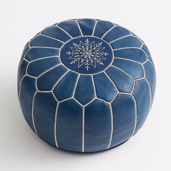 Blue leather pouf with white geometric stitching pattern