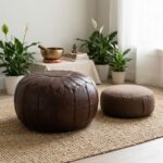 A peaceful meditation corner featuring a large leather Chocolate Brown Ottoman next to a smaller floor cushion on a natural jute rug.