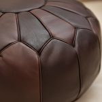 Close-up showing the rich, multi-tonal texture and stitching detail of the Chocolate Brown Ottoman leather.