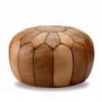 Tan leather round ottoman with scalloped panel design and contrast stitching, handcrafted floor pouf seating