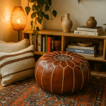 Handcrafted leather floor ottoman on Persian rug with cozy bohemian home decor and bookshelf styling
