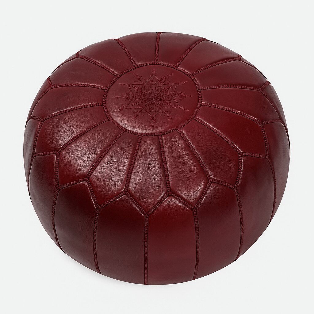 Deep Red Leather Pouf Round with Moroccan embroidery, displayed on plain background. Deep red leather floor ottoman with Moroccan starburst stitching, round 21-inch handcrafted pouf