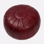 Deep Red Leather Pouf Round with Moroccan embroidery, displayed on plain background.