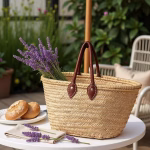 Straw bag with leather handles styled with lavender and pastries