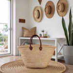 Straw bag with leather handles styled in contemporary space