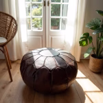 Dark brown Moroccan pouf in bright interior setting