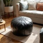 Black leather floor ottoman in living room - moroccan style round pouf perfect for extra seating