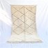 White Beni Ourain rug with handwoven diamond pattern displayed on white background with natural fringe detail