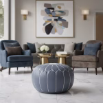 Leather Pouf Gray placed in an elegant living room with velvet chairs and marble flooring.