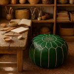 Leather Pouf Green placed in a rustic artisan studio, surrounded by wooden tools, sketchbooks, and pottery.