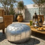 Silver leather round ottoman on outdoor patio with Moroccan decor - versatile floor seating pouf
