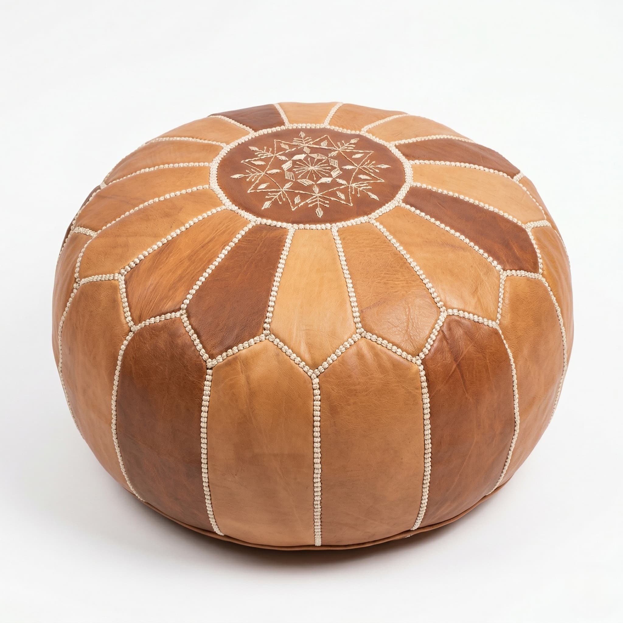 Leather Round Ottoman (7) A handcrafted tan and brown Leather Round Ottoman featuring a traditional Moroccan star-stitched mandala design on a clean white background.