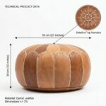 Technical product data for a Leather Round Ottoman showing dimensions of 53 cm (21 inches) width and 30 cm (12 inches) height, made from authentic camel leather.