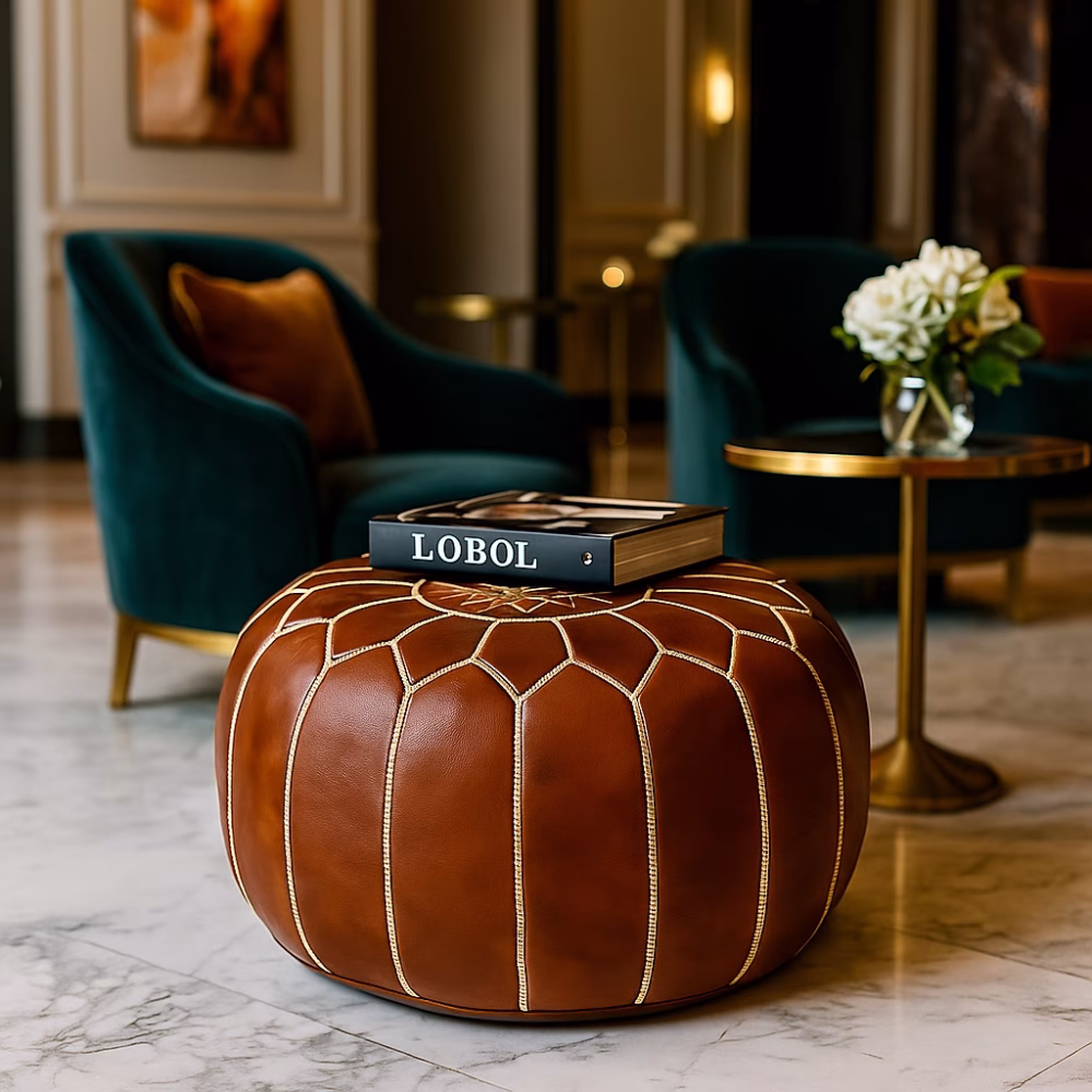Minimalist interior with a leather pouf brown centered on a neutral rug, emphasizing its timeless elegance.