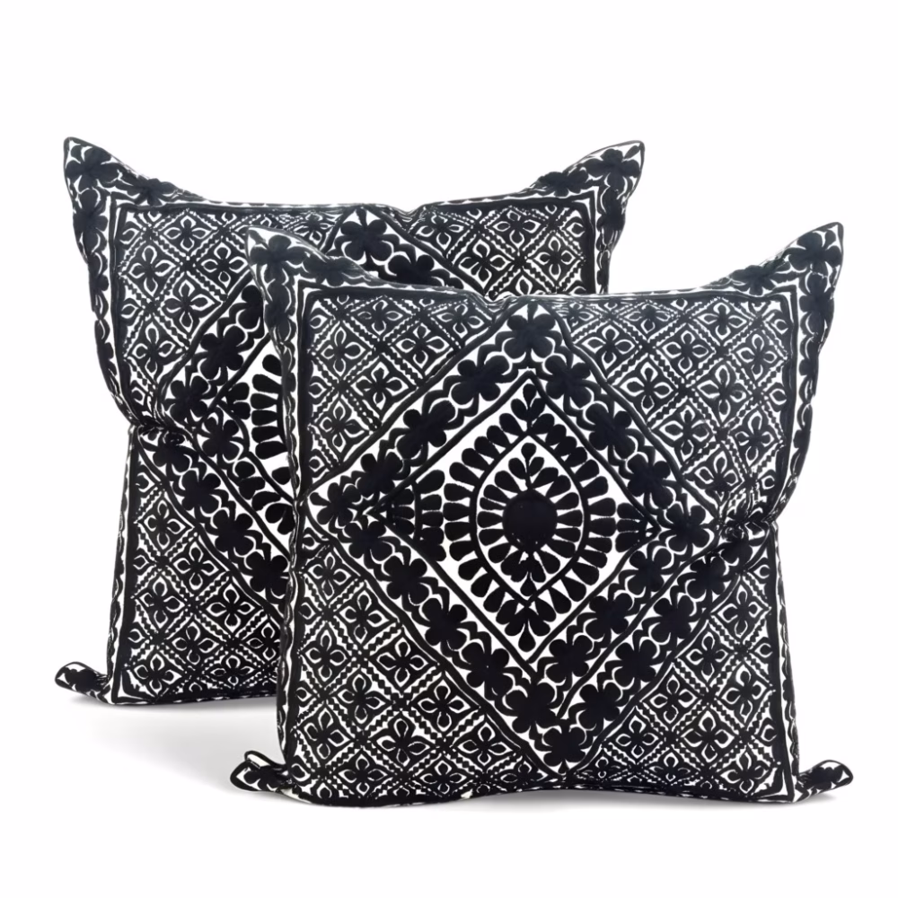 Product photo of black geometric embroidered pillow cover set