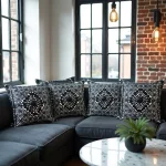 Set of geometric embroidered pillow covers on dark sofa