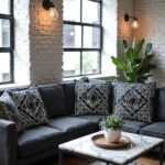 Set of geometric embroidered pillow covers on dark sofa