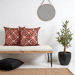 Modern entryway with geometric pillow covers in terracotta on bench, minimal Scandinavian style decor