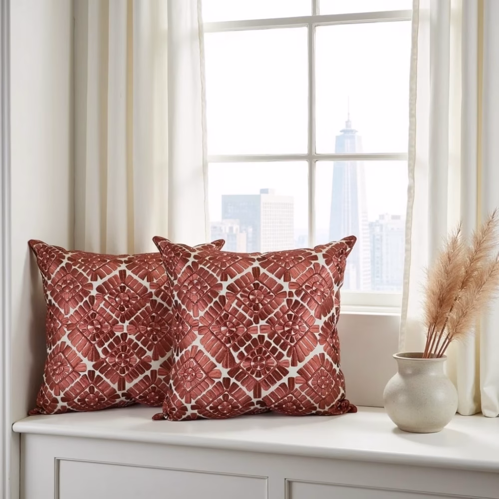 Geometric pattern pillow covers by window with pampas grass