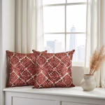 Geometric pattern pillow covers by window with pampas grass