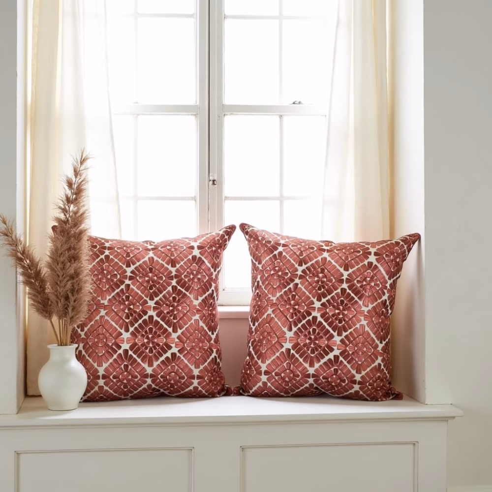 Geometric pattern pillow covers by window with pampas grass