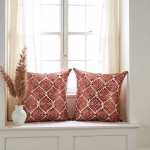 Geometric pattern pillow covers by window with pampas grass