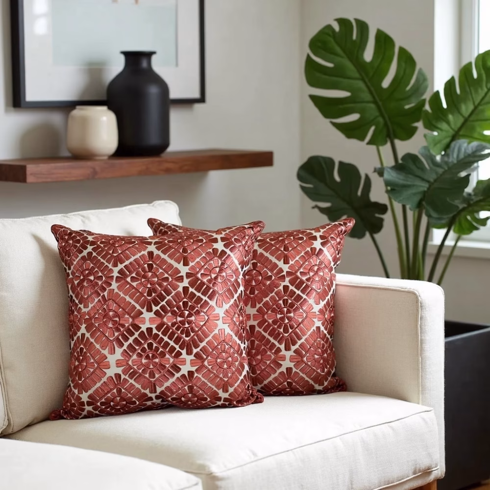 Geometric pillow covers styled on white sofa with plants
