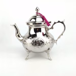 Authentic Moroccan silver teapot on white background