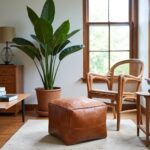 Square leather ottoman 16 inch cognac pouf paired with rattan chair near window and tropical plant