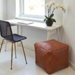 Square leather ottoman 16 inch cognac leather pouf in minimalist office with desk and orchid