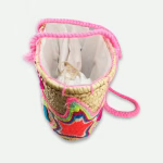 Pink embroidered straw basket bag with star pattern and cotton handles
