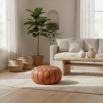 Natural leather round ottoman floor pouf in minimalist bedroom with wooden bed and neutral decor
