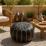 Round black leather floor ottoman 21 inch with white embroidery on outdoor patio beside Moroccan tea set
