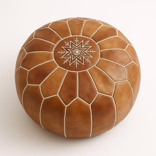 Overhead view of handcrafted natural leather pouf with white stitching