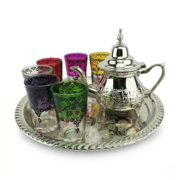 Professional studio shot of a polished Silver Tea Set featuring an engraved teapot and six vibrant, multi-colored glasses on a matching round tray.