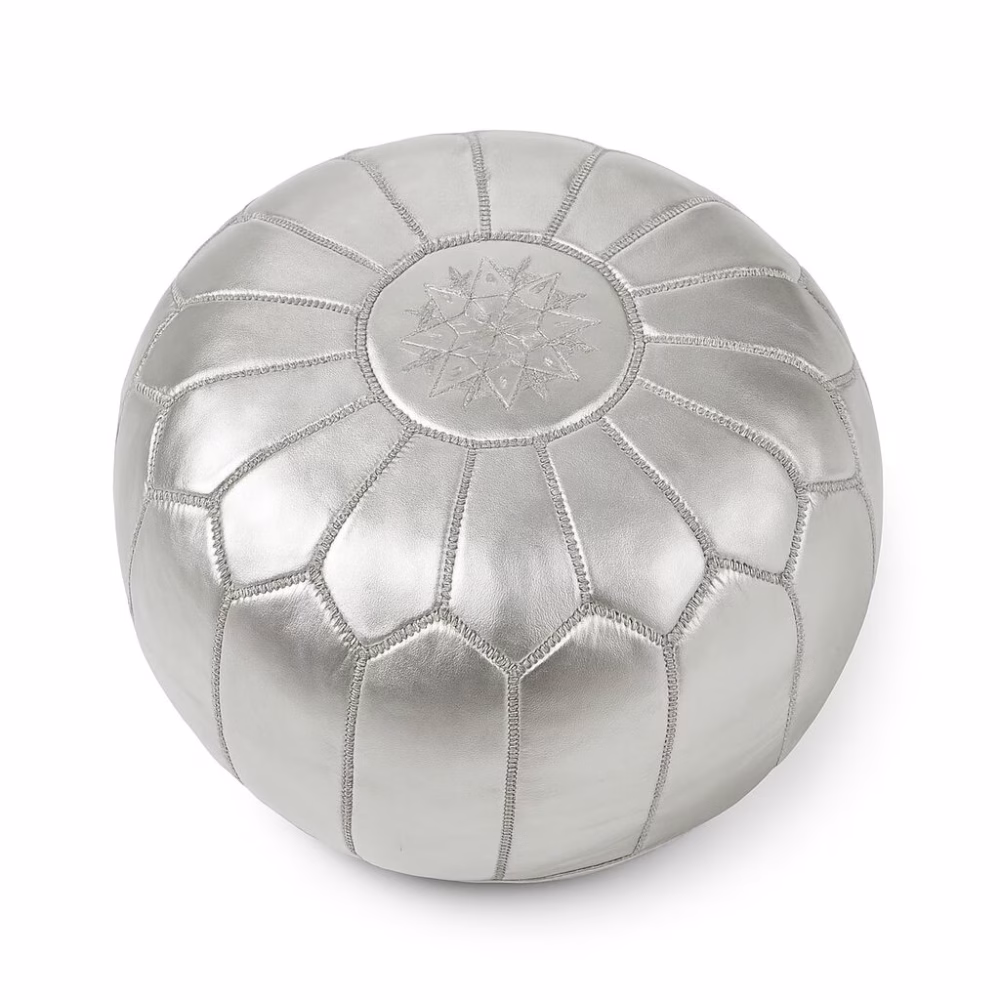 Silver leather pouf with intricate white stitching pattern