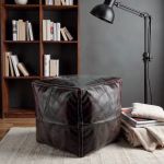 Leather pouf square in reading nook with lamp