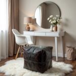 Handcrafted square leather floor ottoman near sunny window with rattan chair and tropical plant decor