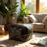 Dark square leather floor ottoman with cream stitching on shag rug near sofa in cozy living space