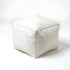 Front view of white square leather pouf