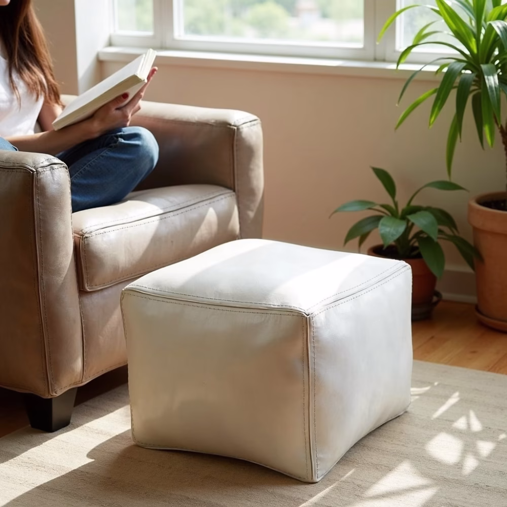 White square leather pouf in sunny living room