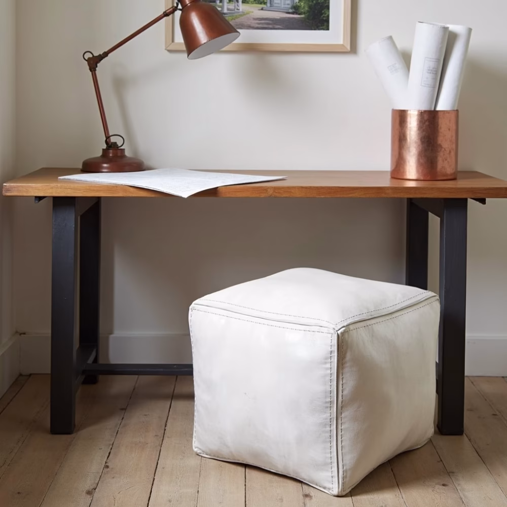 Modern desk arrangement with white ottoman