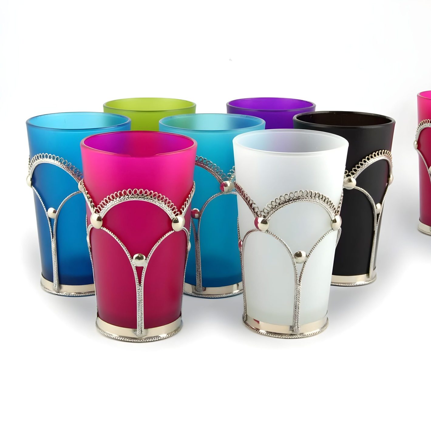 Colorful tea glasses with ornate silver filigree holders in vibrant jewel tones including blue, pink, white, and black