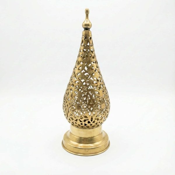 Isolated product view of a handcrafted Moroccan brass bedside lamp featuring a teardrop shape and detailed metal cutouts on a white background.