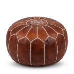 Brown leather round ottoman with embroidered geometric star pattern and hand-stitched central medallion