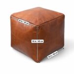A handcrafted Cognac Square Leather Pouf displayed on a white background, featuring overlaid measurement arrows showing equal dimensions of 16 inches (40 cm) for its width, depth, and height.