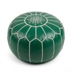 A premium green leather floor ottoman featuring a traditional star-shaped embroidery and white hand-stitched detailing on a solid white background.